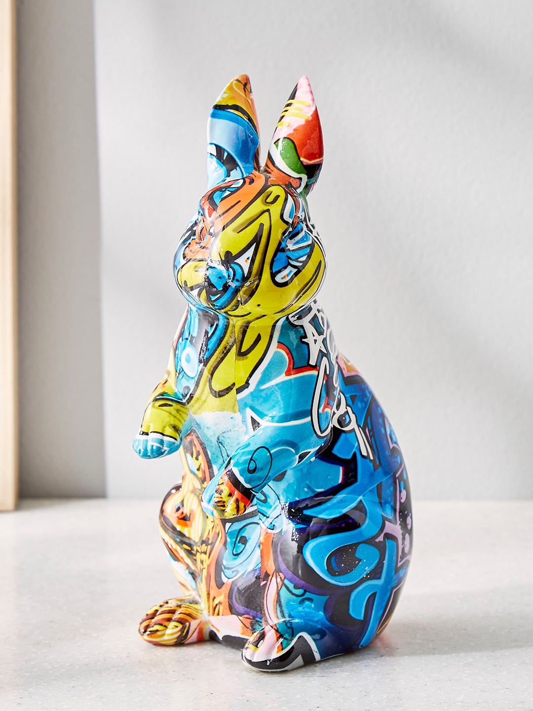 

Home Centre Blue & Orange Polyresin Rabbit Showpieces