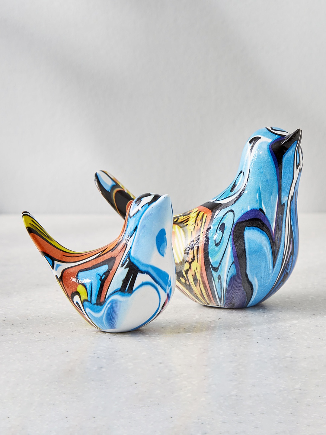 

Home Centre Blue 2 Pieces Birds Figurine Showpieces
