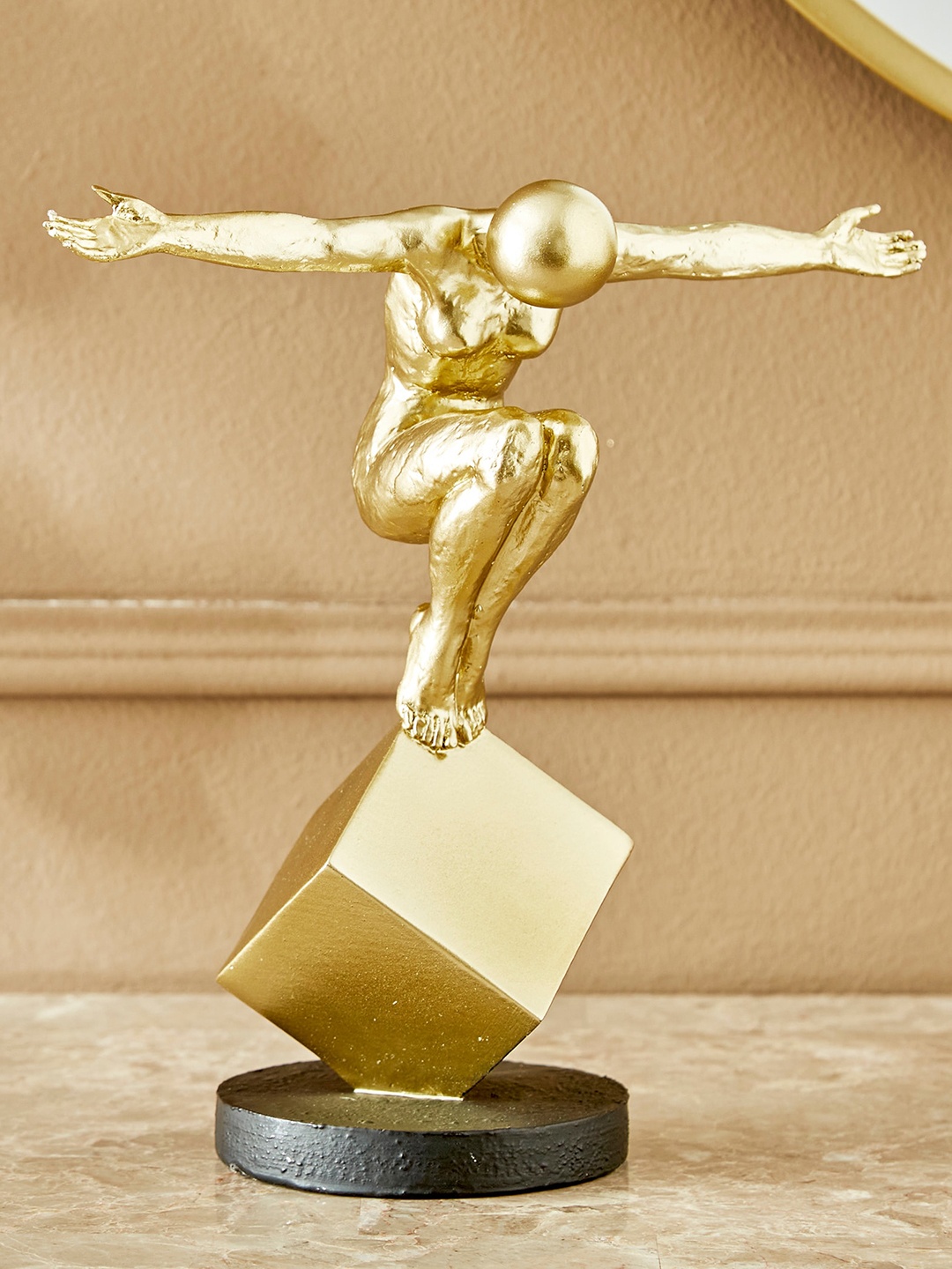 

Home Centre Gold-Toned & Black Human Balancing Showpiece