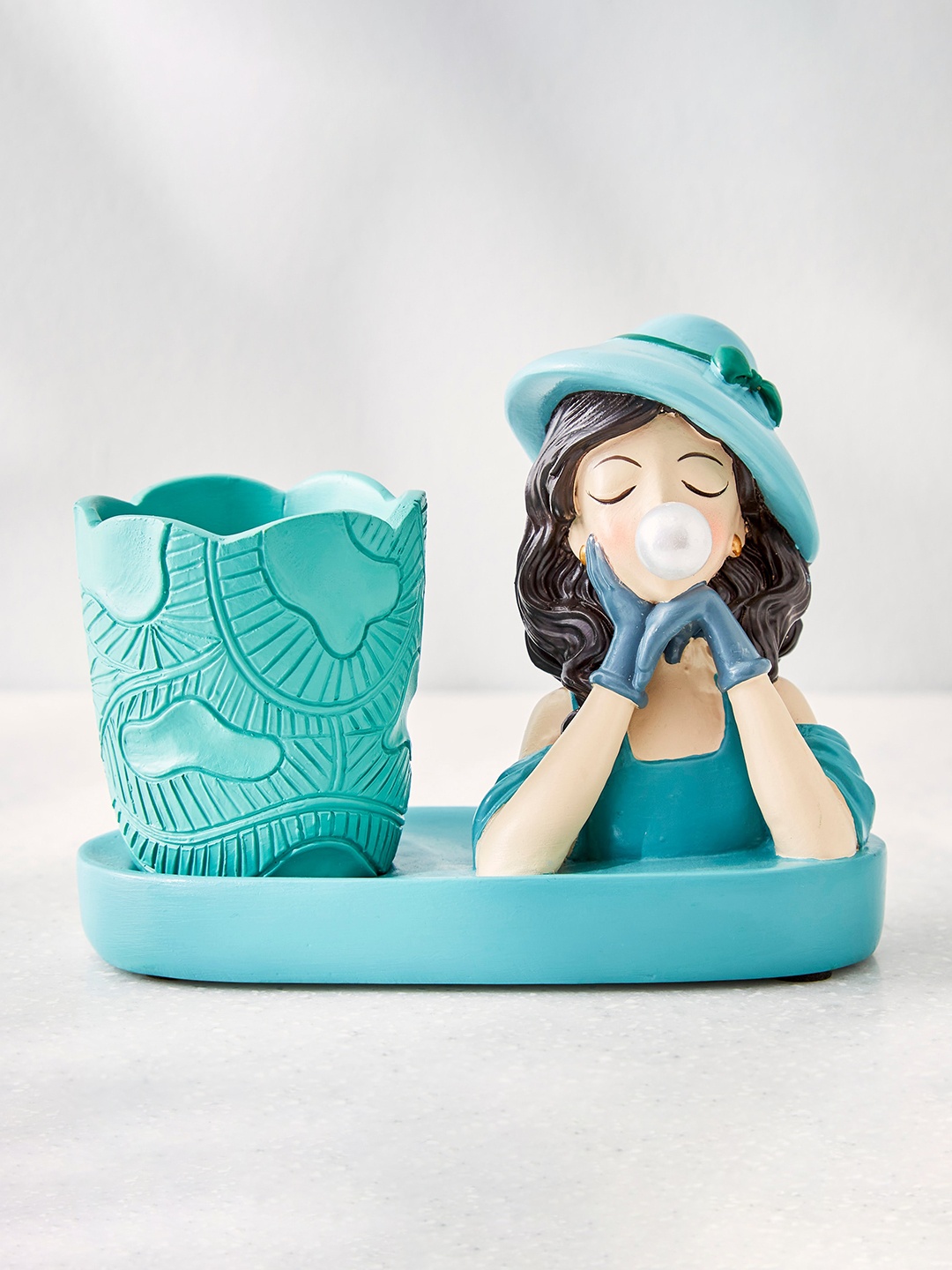 

Home Centre Blue & Beige Girl With Pen Holder Showpieces