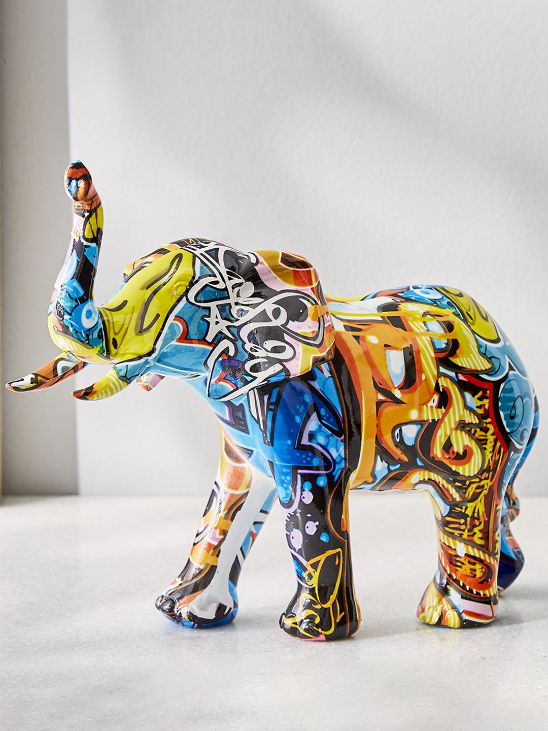 

Home Centre Corsica Blue Textured Elephant Figurine Showpiece