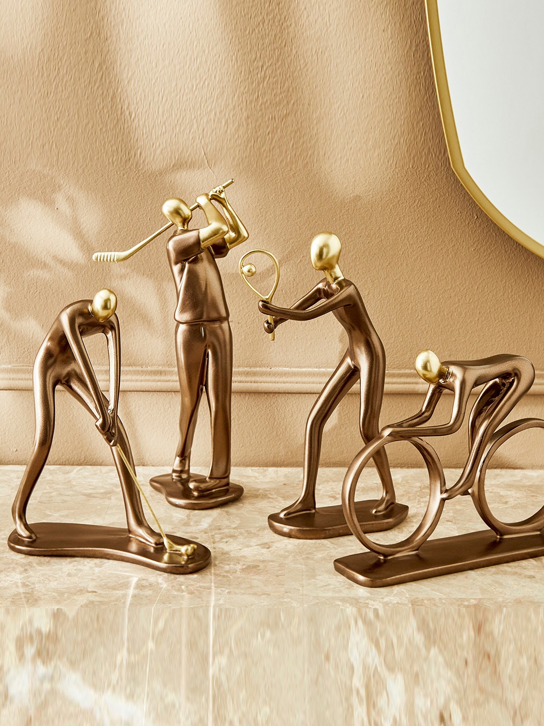 

Home Centre Eternity Vogue Gold Toned & Brown Tennis Player Polyresin Showpiece
