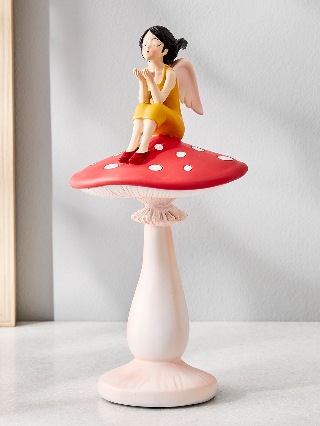 

Home Centre Souvenir White & Red Girl On Mushroom Figurine Polyresin Showpiece