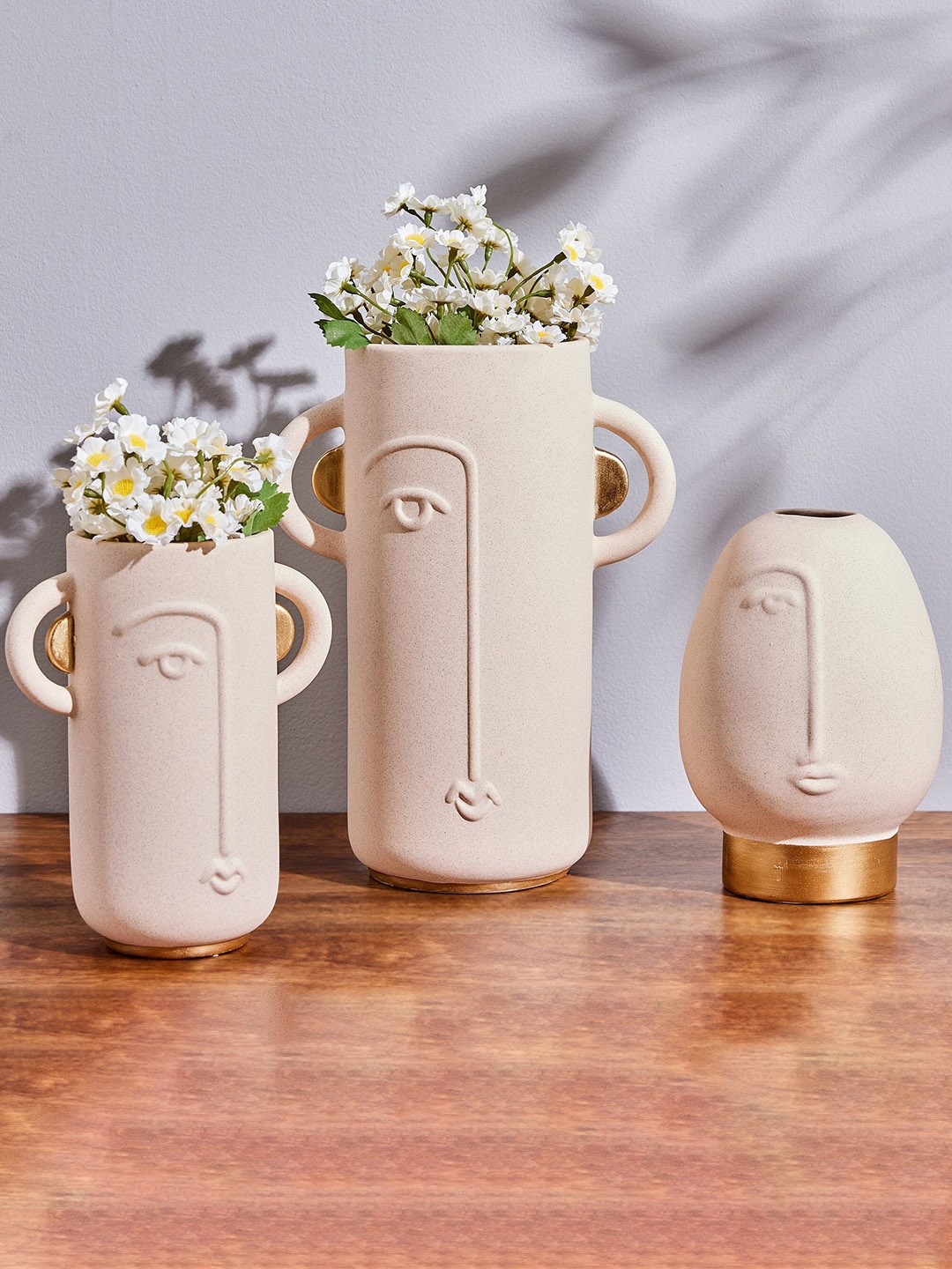 

Home Centre Marshmallow Centre Beige Textured Ceramic Human Face Vase