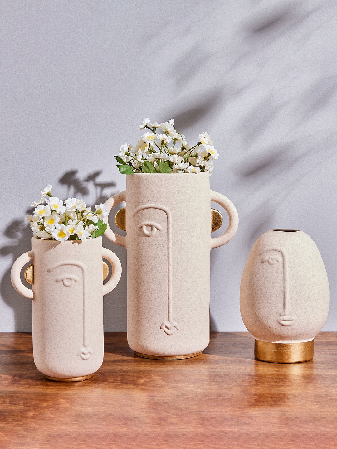 

Home Centre Marshmallow Beige Textured Ceramic Human Face Vase
