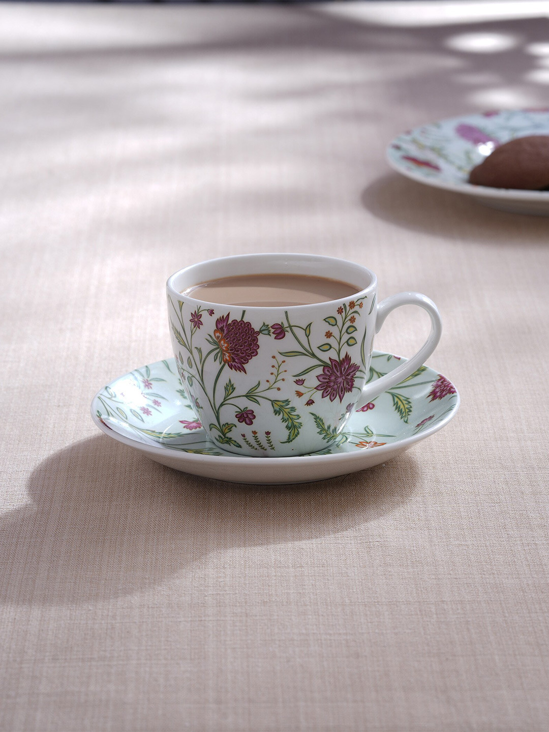 

Home Centre Lucas White & Green 2 Pcs Printed Bone China Matte Cups and Saucers - 210ml