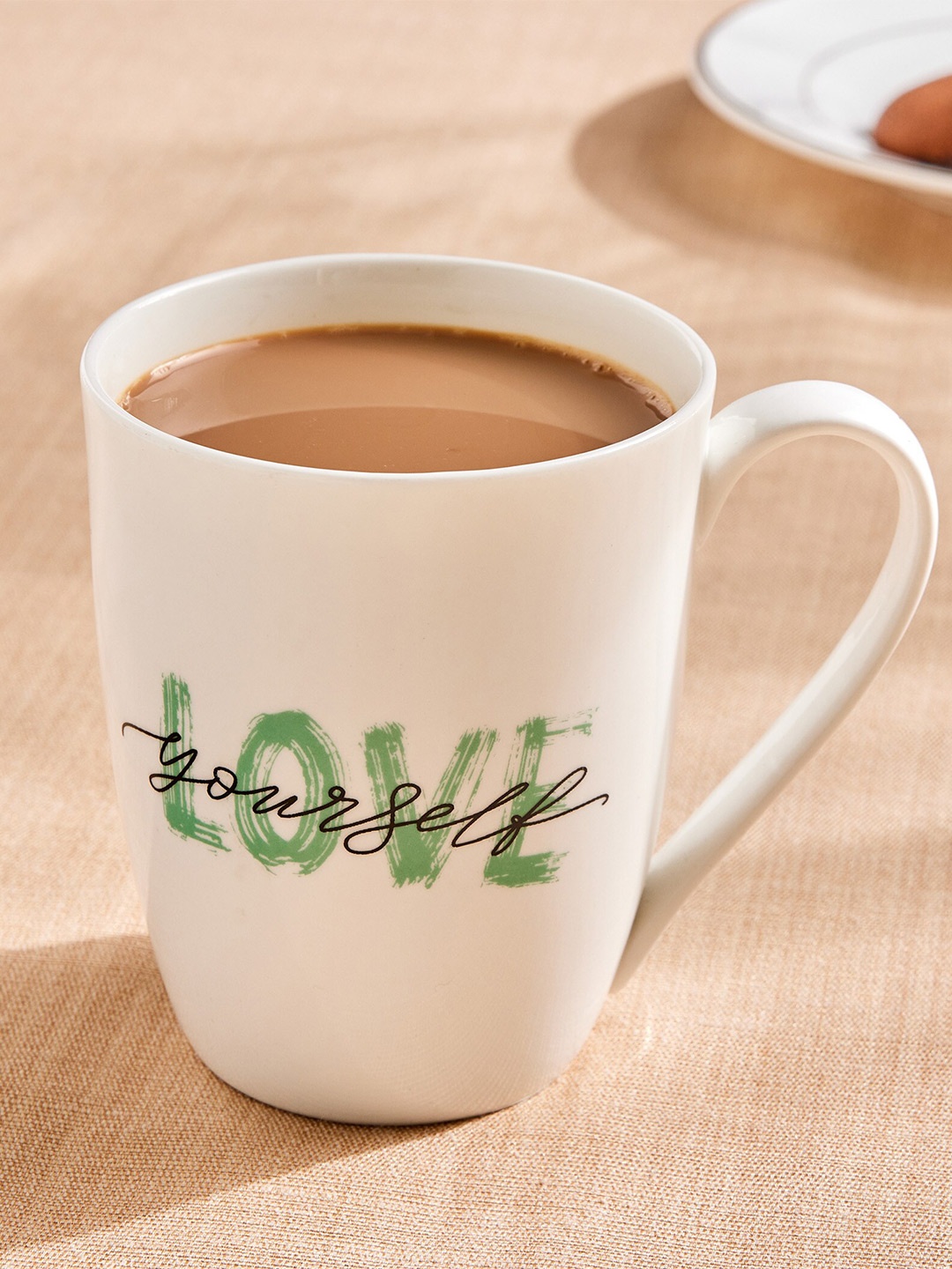 

Home Centre White Printed Bone China Glossy Mugs -340ml