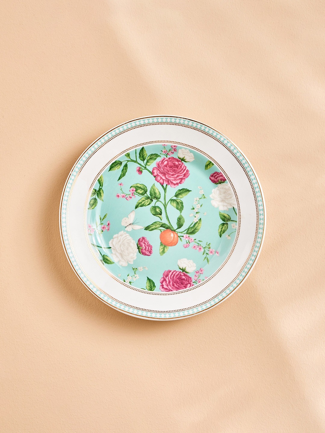 

Home Centre 1 Piece White & Blue Ethnic Motifs Printed Bone China Matte Plate