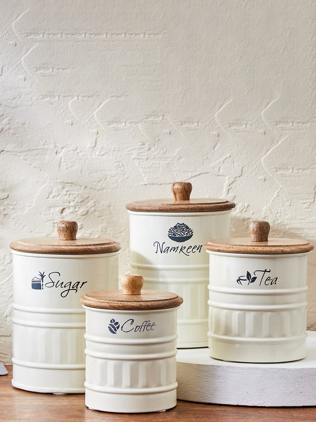 

Home Centre Mirage Cream-Colored & Brown Printed Iron Namkeen Canister With Mango Wood Lid