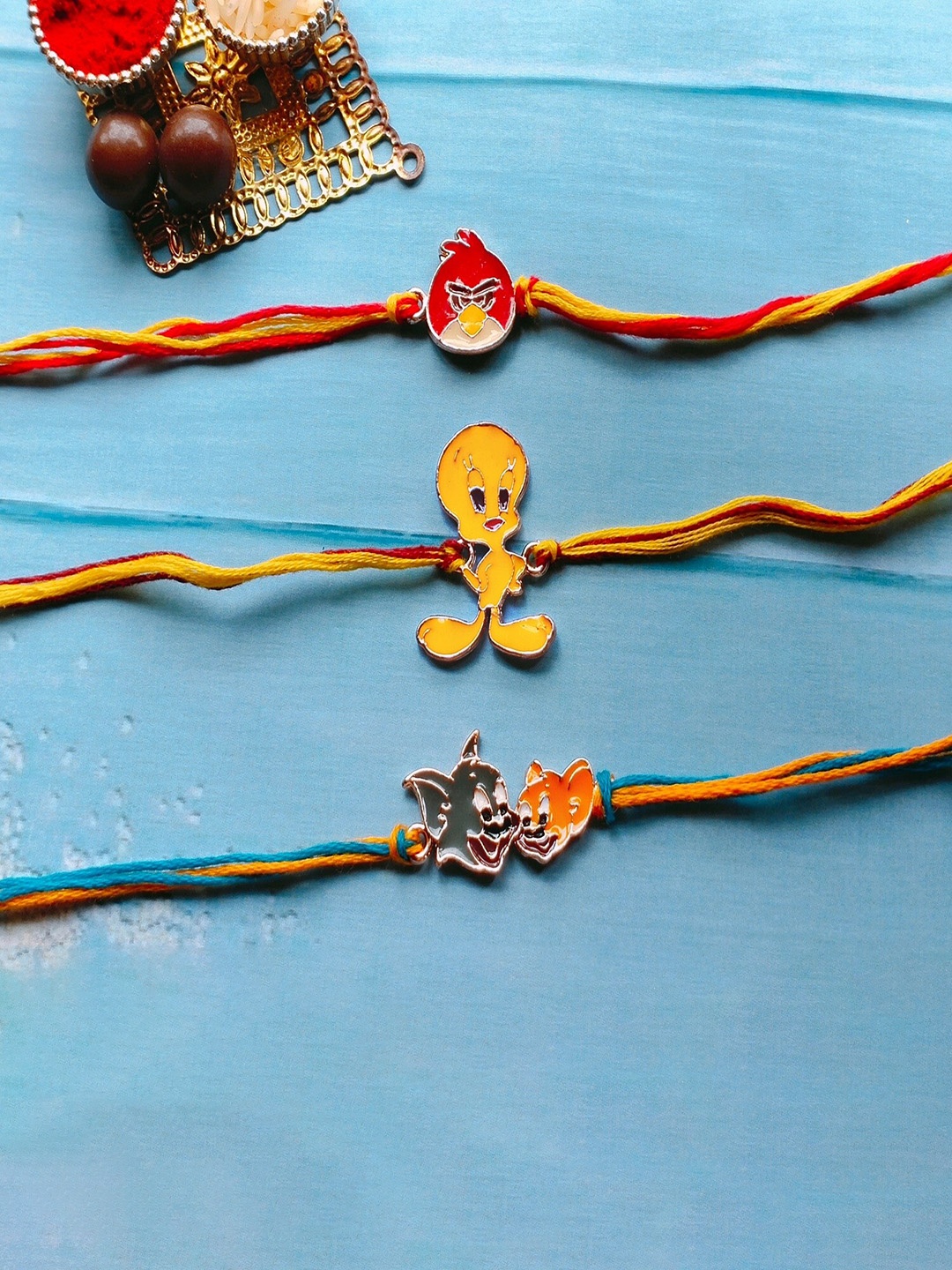 

Mahi Set Of 3 Enamelled Cartoon Rakhis, Red