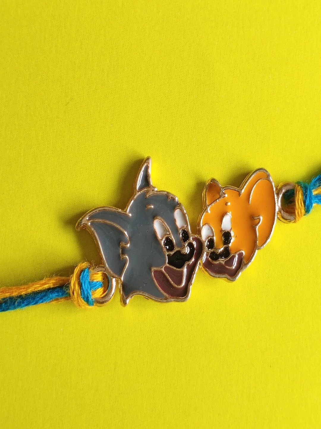 

Mahi Kids Meenakari Work Enamel Rakhi, Rose gold