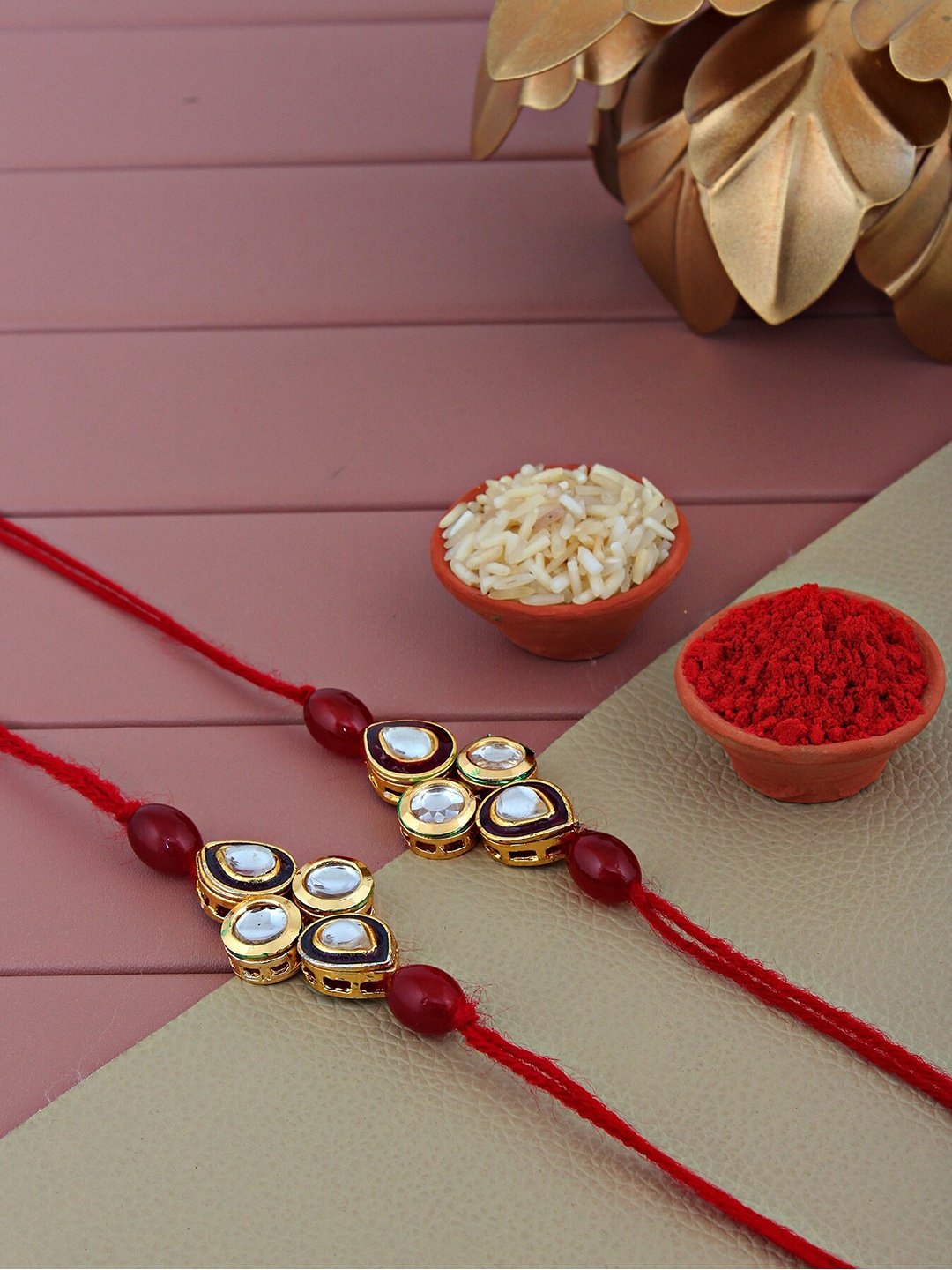 

LUCKY JEWELLERY Pack Of 2 Textured Stone-Studded Meenakari Rakhis, Gold