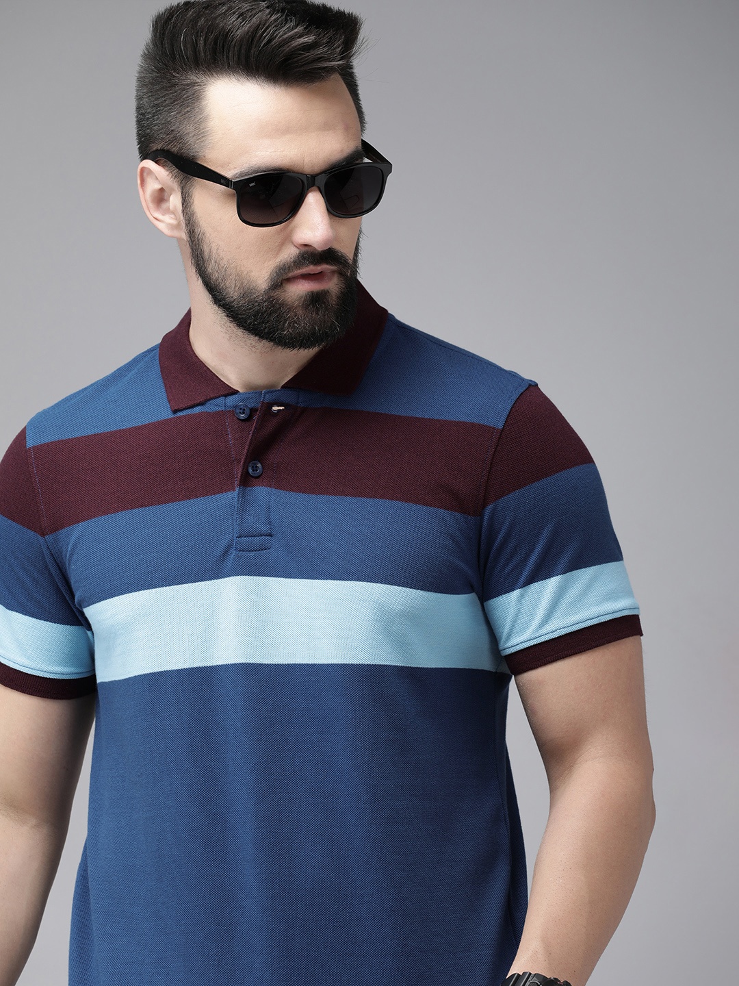 

Roadster Men Striped Polo Collar T-shirt, Blue