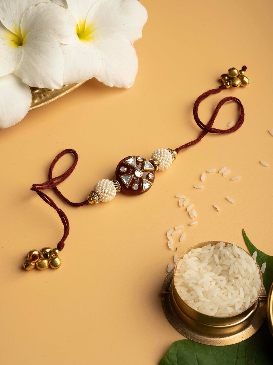 

TEEJH Kundan Studded & Pearls Beaded Thread Rakhi, Maroon