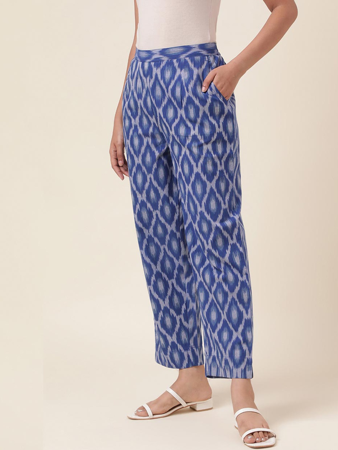 

Fabindia Women Geometric Printed Plain Tapered Fit Cotton Regular Trousers, Blue