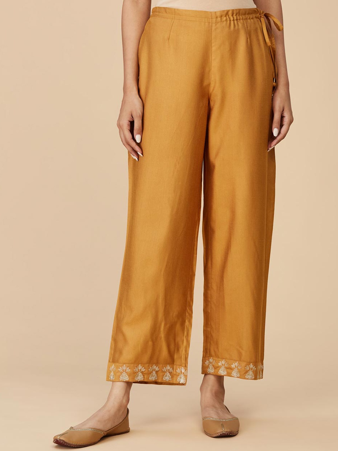 

Fabindia Women Mid Rise Plain Cropped Parallel Trousers, Mustard