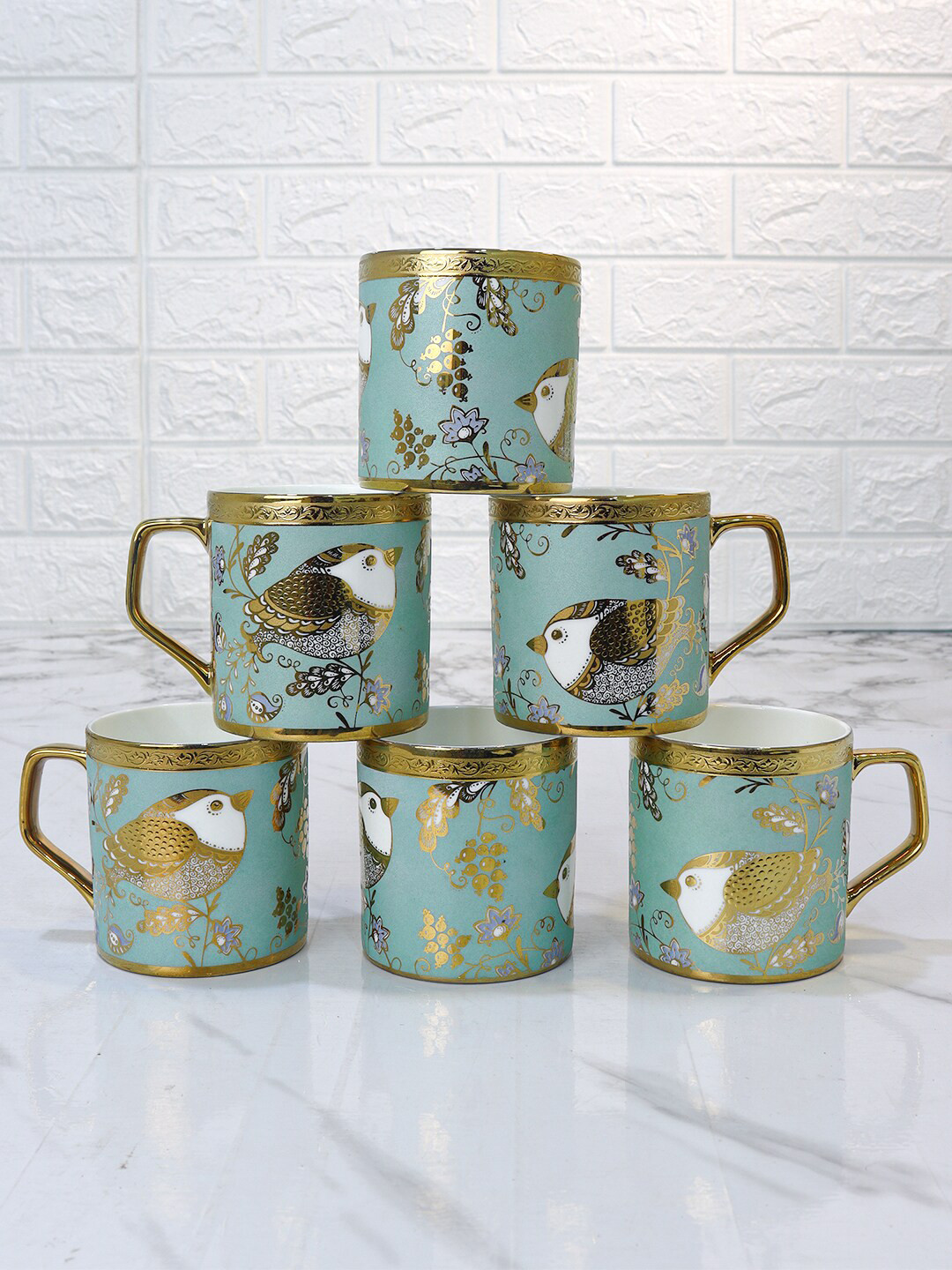 

Femora Goldcrest Gold & Green 6-Pieces Ethnic Motifs Printed Ceramic Glossy Mugs 180ml