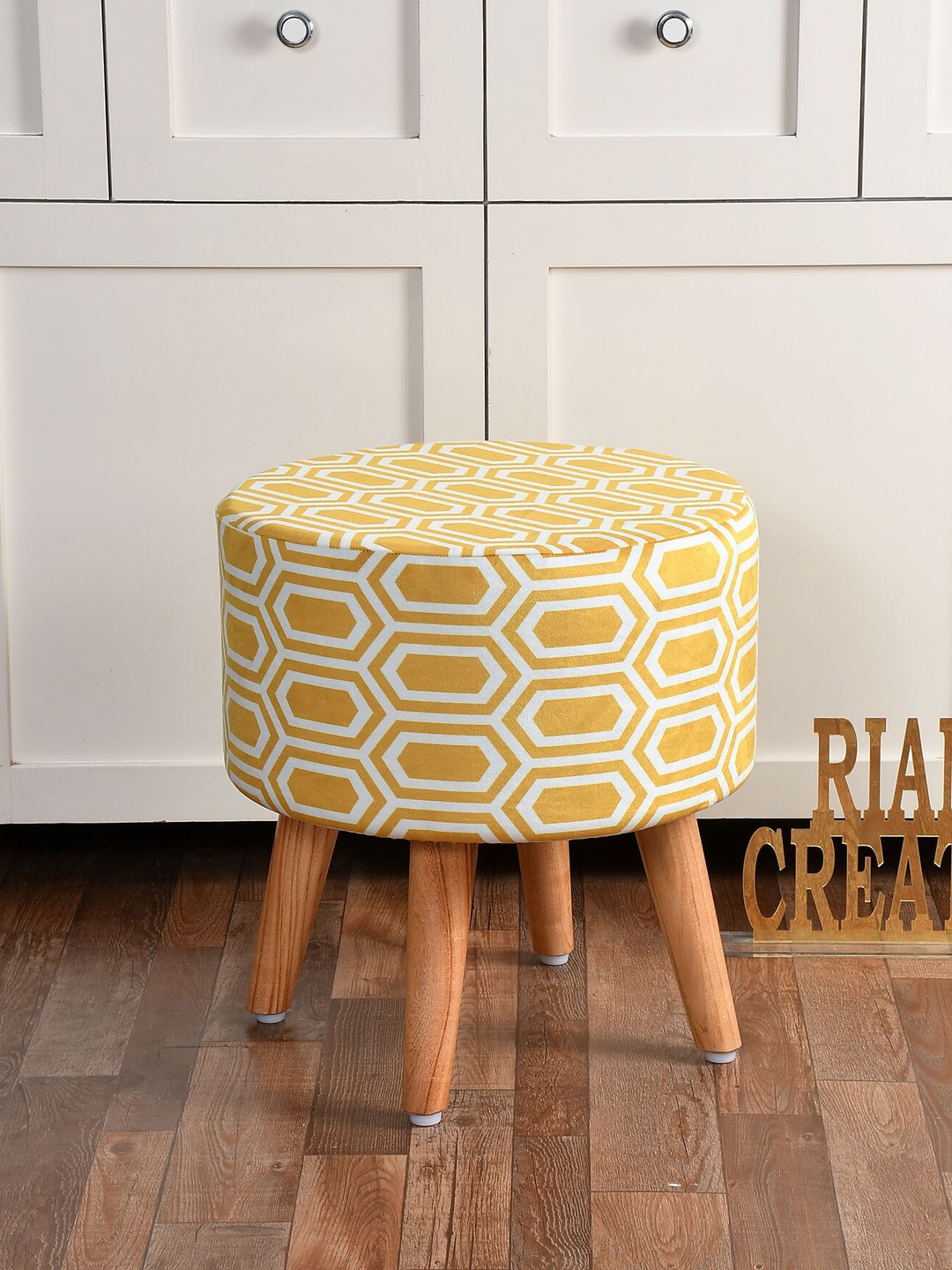 

RIANCE CREATIONS Yellow & Brown Printed Wooden Round Ottoman