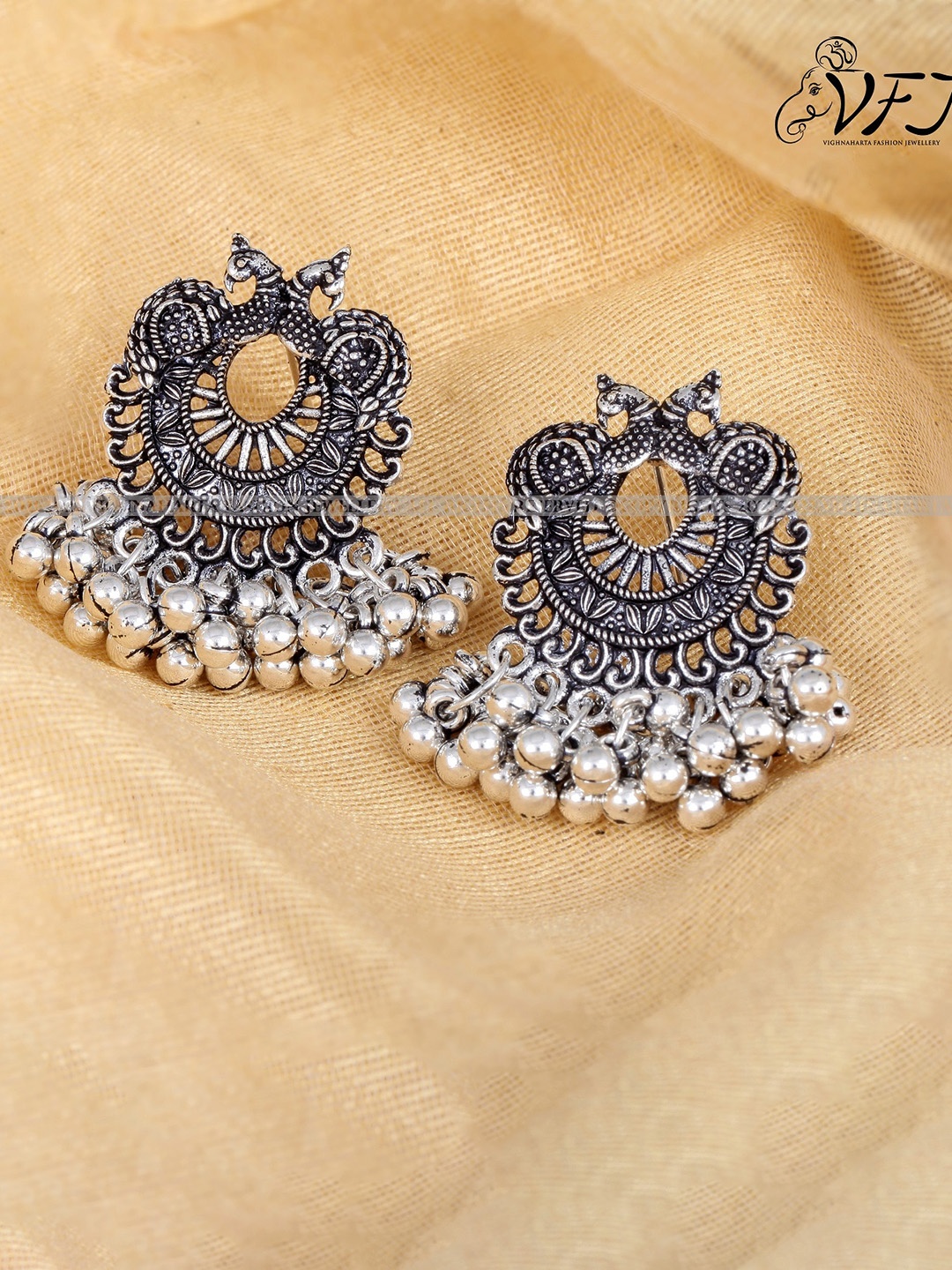 

Vighnaharta Silver-Plated Oxidised Peacock Shaped Drop Earrings