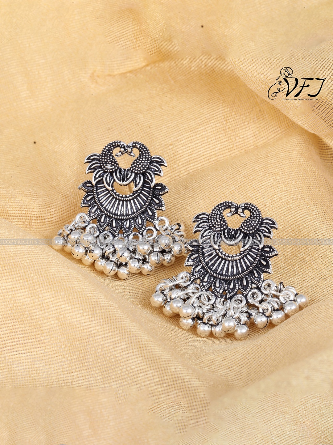 

Vighnaharta Silver-Plated Peacock Shaped Drop Earrings