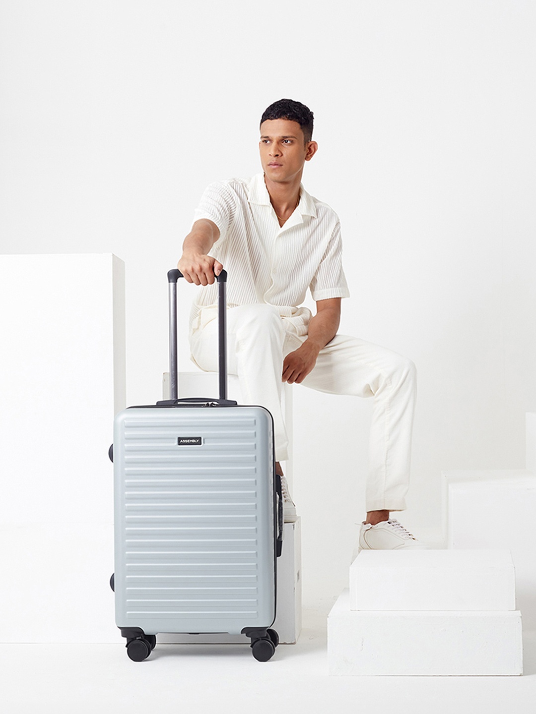 

Assembly Silver Hard-sided Medium Trolley Luggage- 60Liters