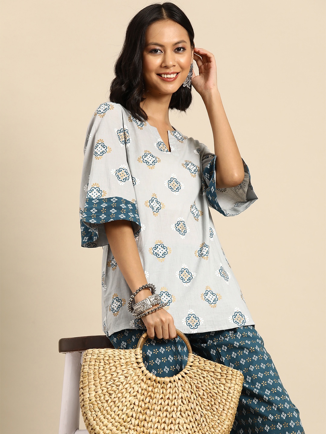 

Sangria Ethnic Motifs Printed Pure Cotton Kurti with Trousers, White