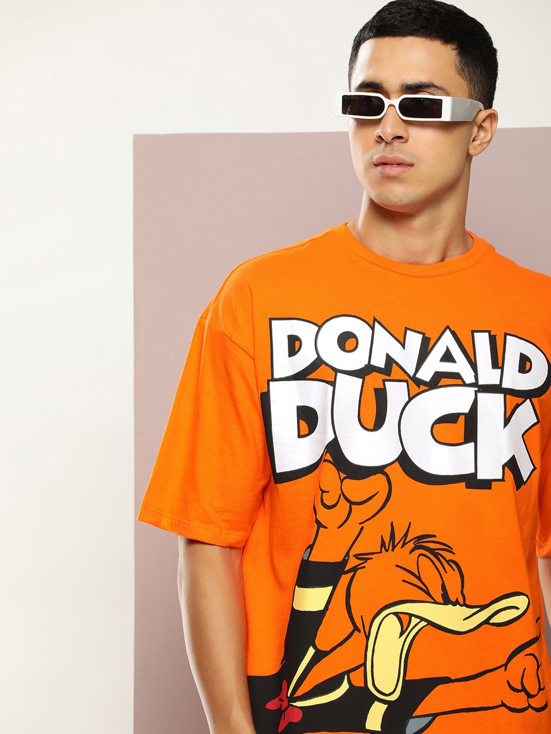 

Kook N Keech Donald Duck Printed Drop-Shoulder Sleeves Pure Cotton Oversized T-shirt, Orange
