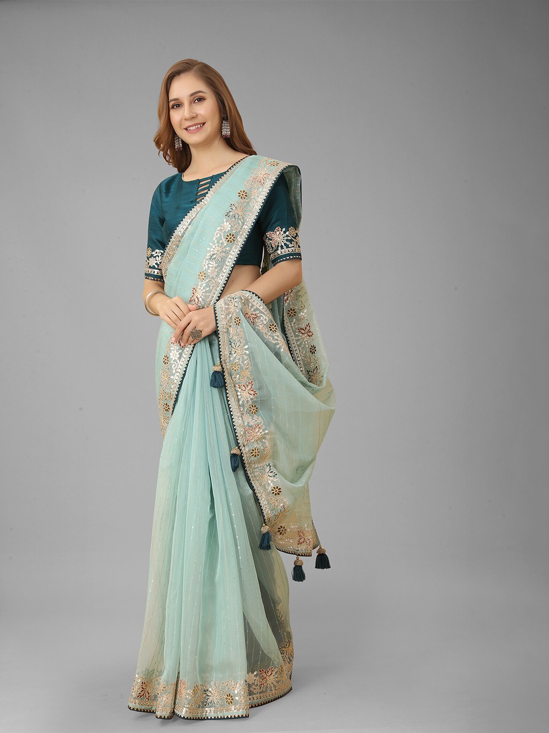 

N N ENTERPRISE Sea Green & Gold-Toned Embellished Zari Net Saree