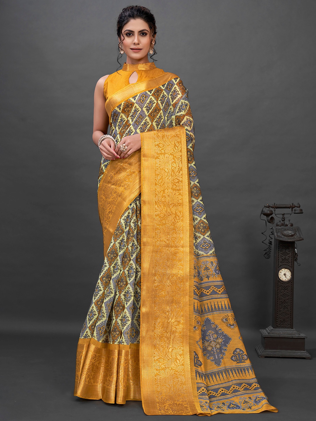 

Mitera Grey & Yellow Ethnic Motifs Printed Zari Sungudi Saree