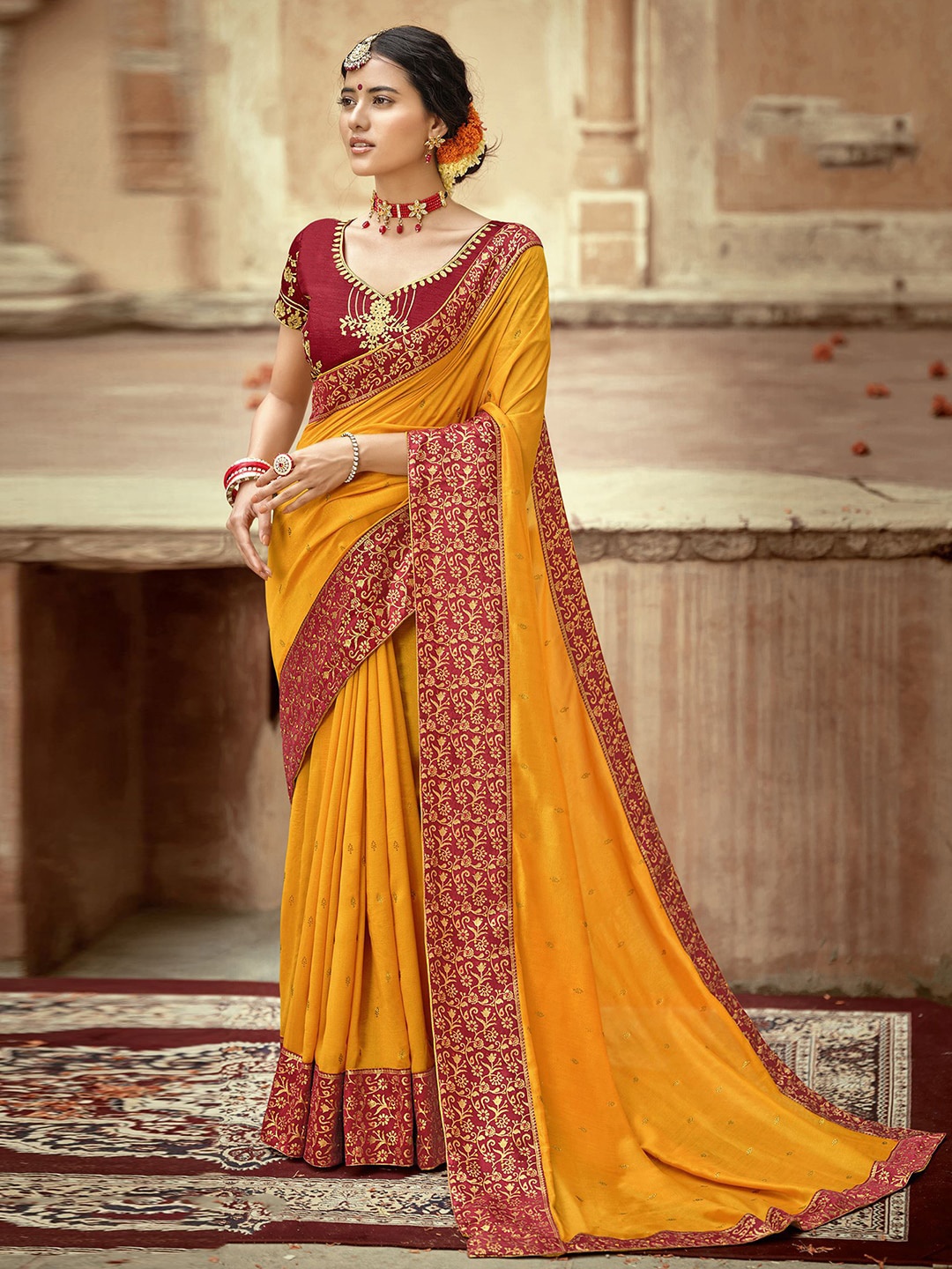 

Mitera Yellow & Red Embellished Art Silk Saree