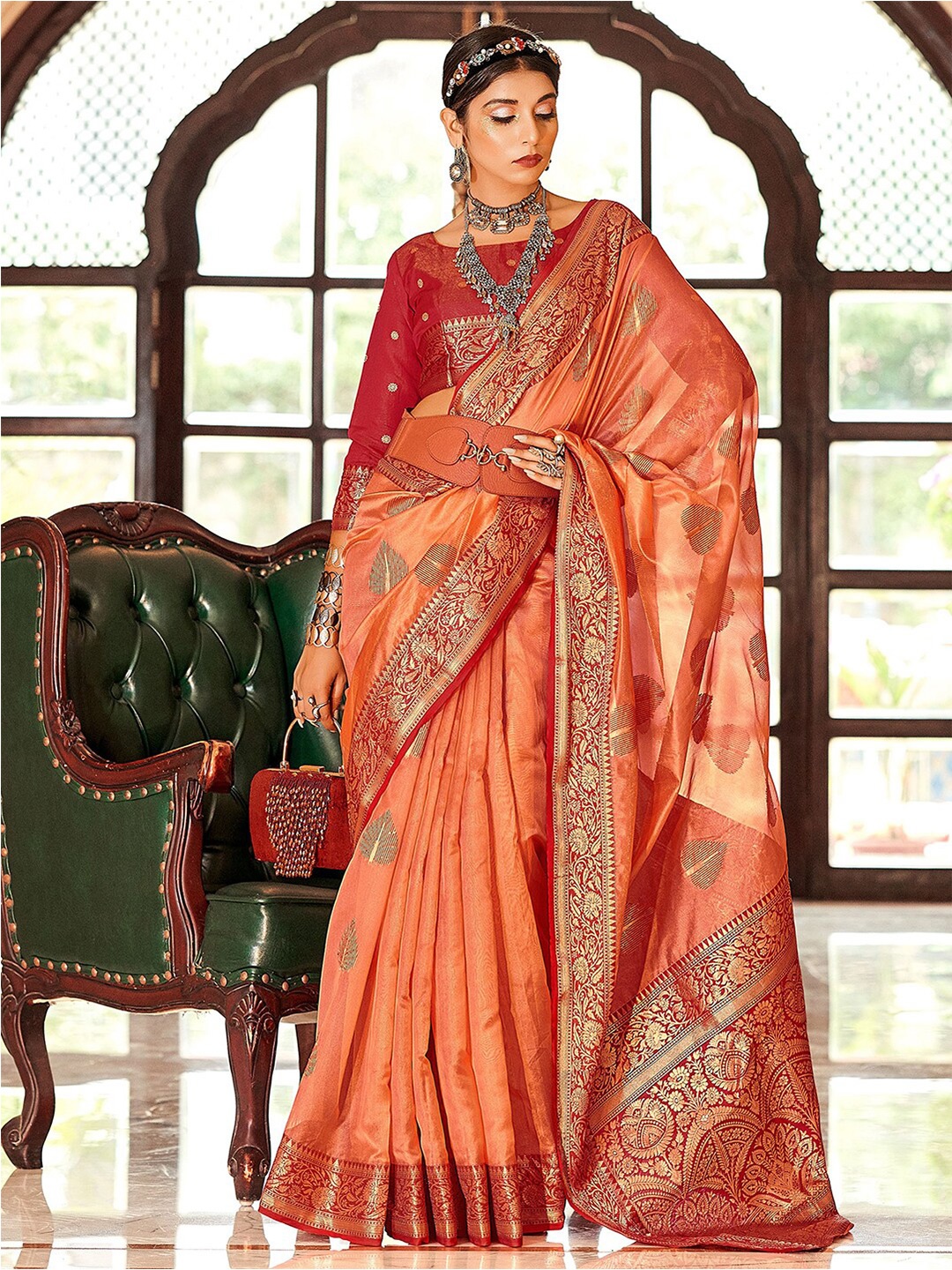 

Mitera Orange & Red Ethnic Motifs Woven Design Zari Organza Saree