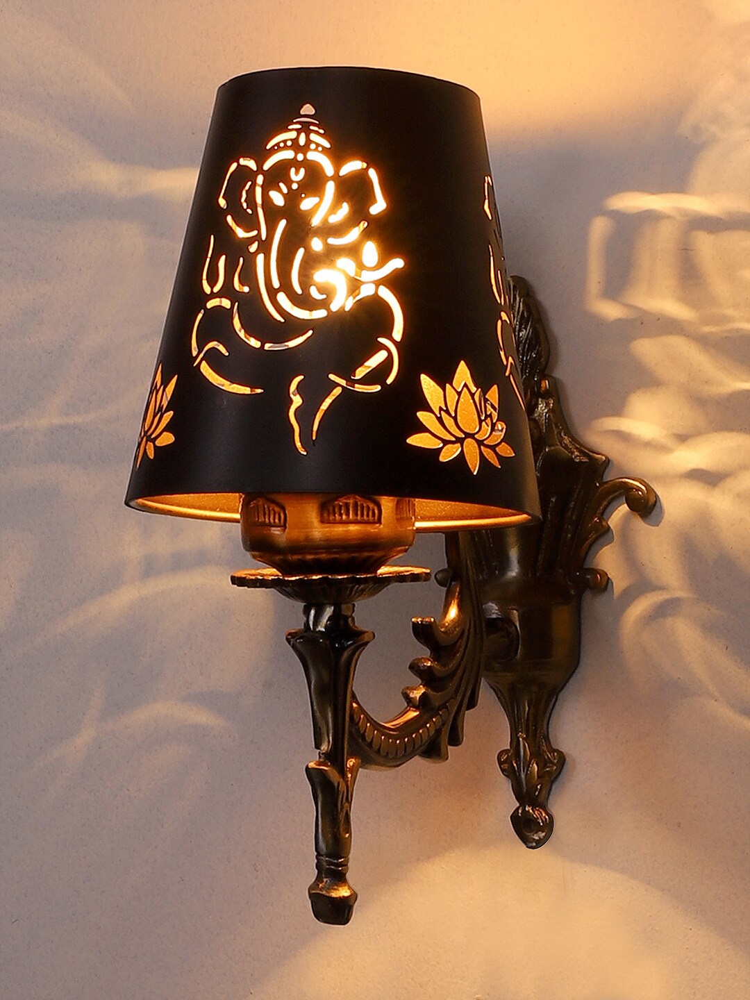 

Devansh Gold Toned & Black Textured Antique Wall Lamp With Etching Lamp Shade