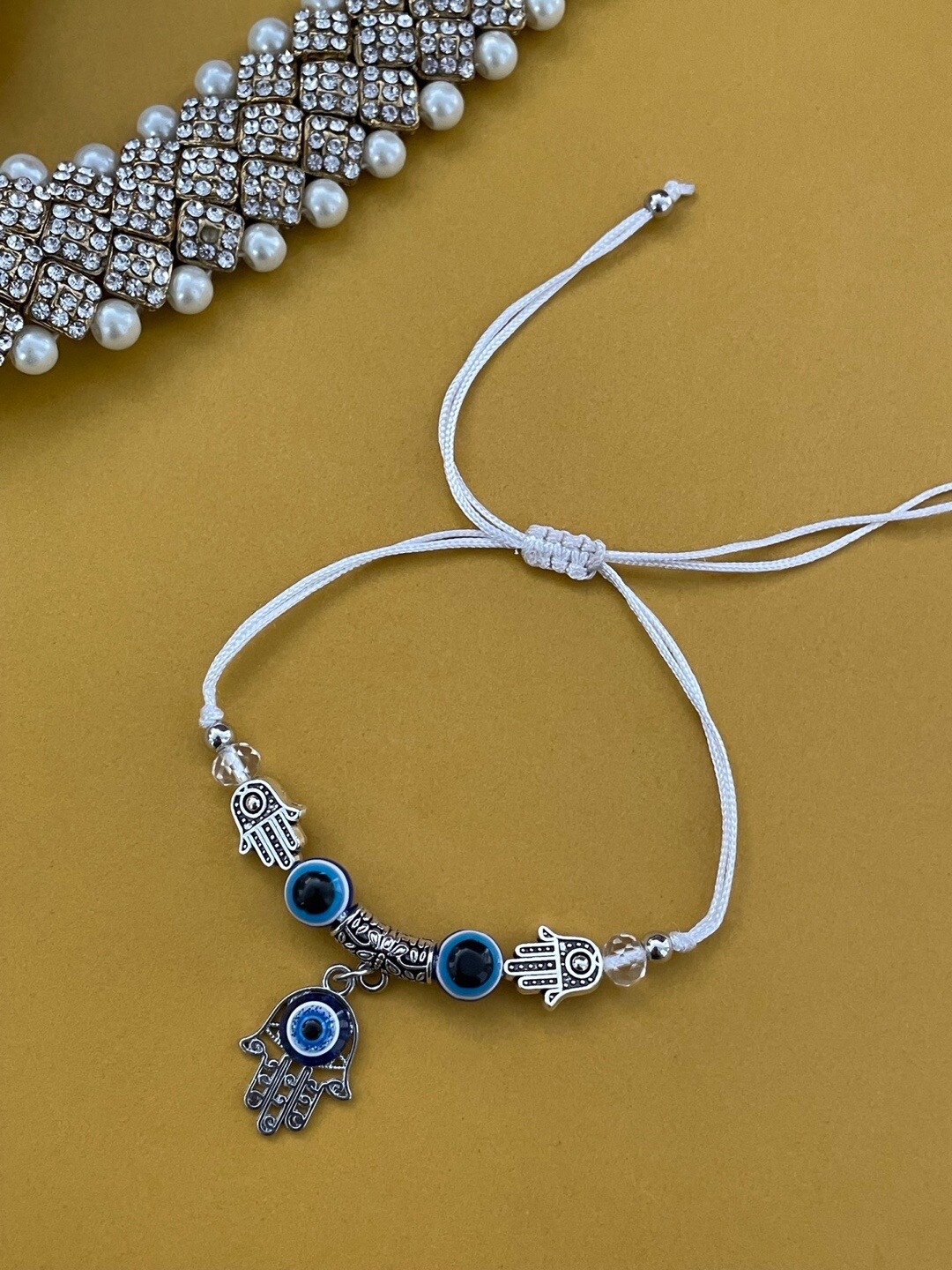 

Digital Dress Room Evil Eye Beaded Thread Rakhi, Silver