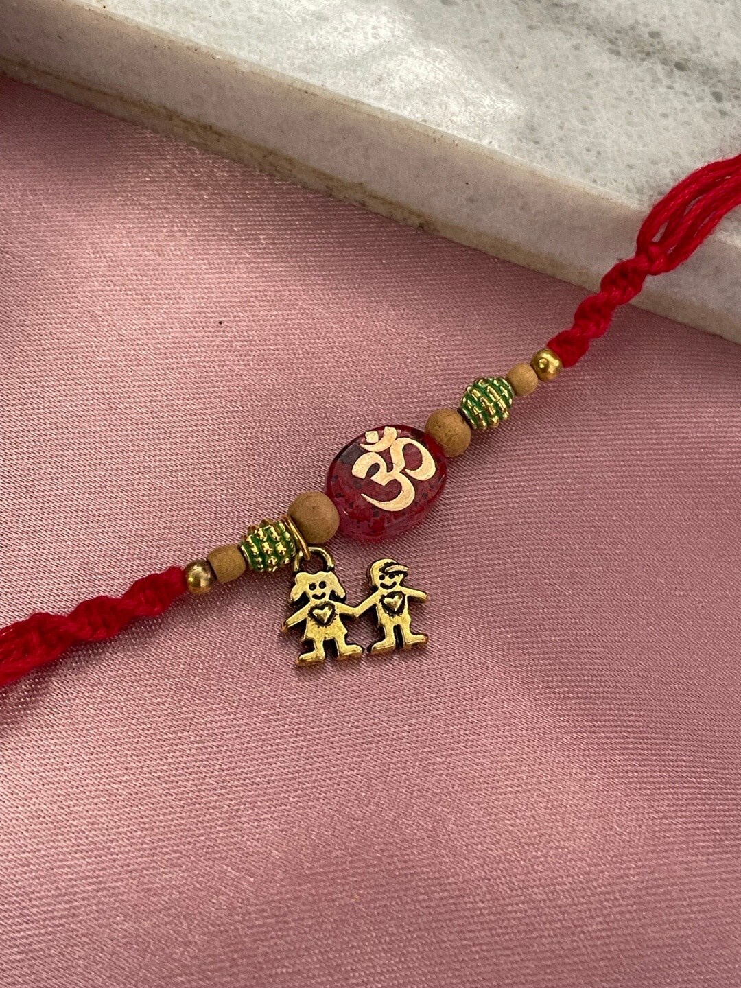 

Digital Dress Room Om With Brother & Sister Charm Rakhi, Gold