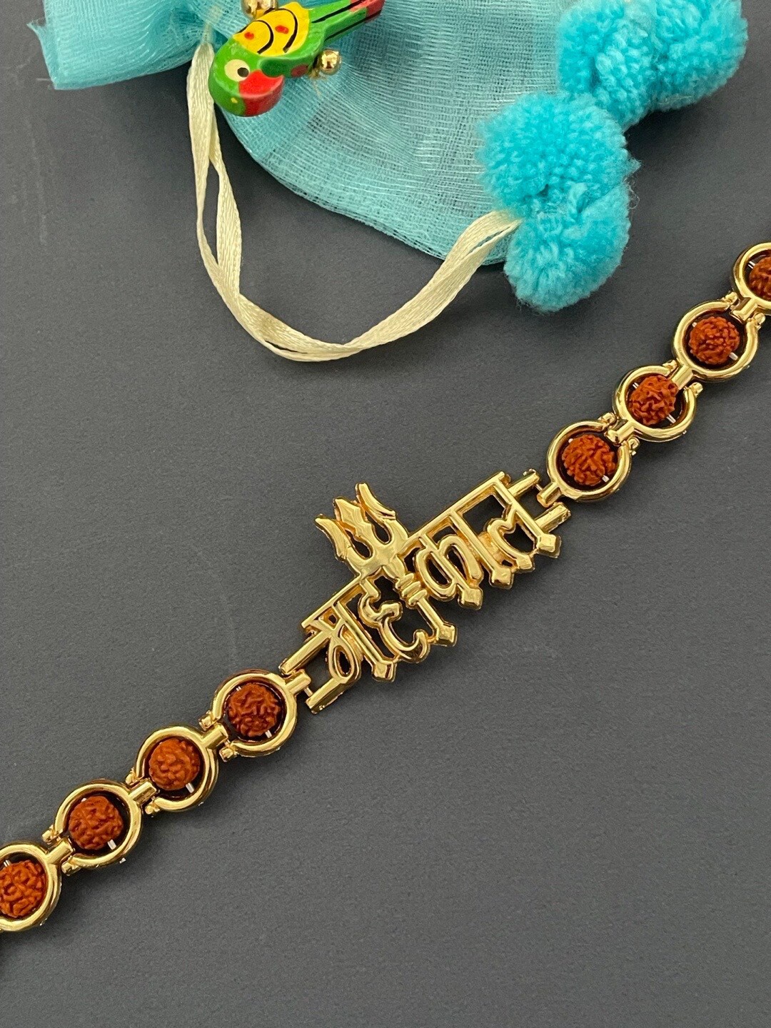

Digital Dress Room Gold-Plated Mahakal With Rudraksha & Trishul Charm Rakhi