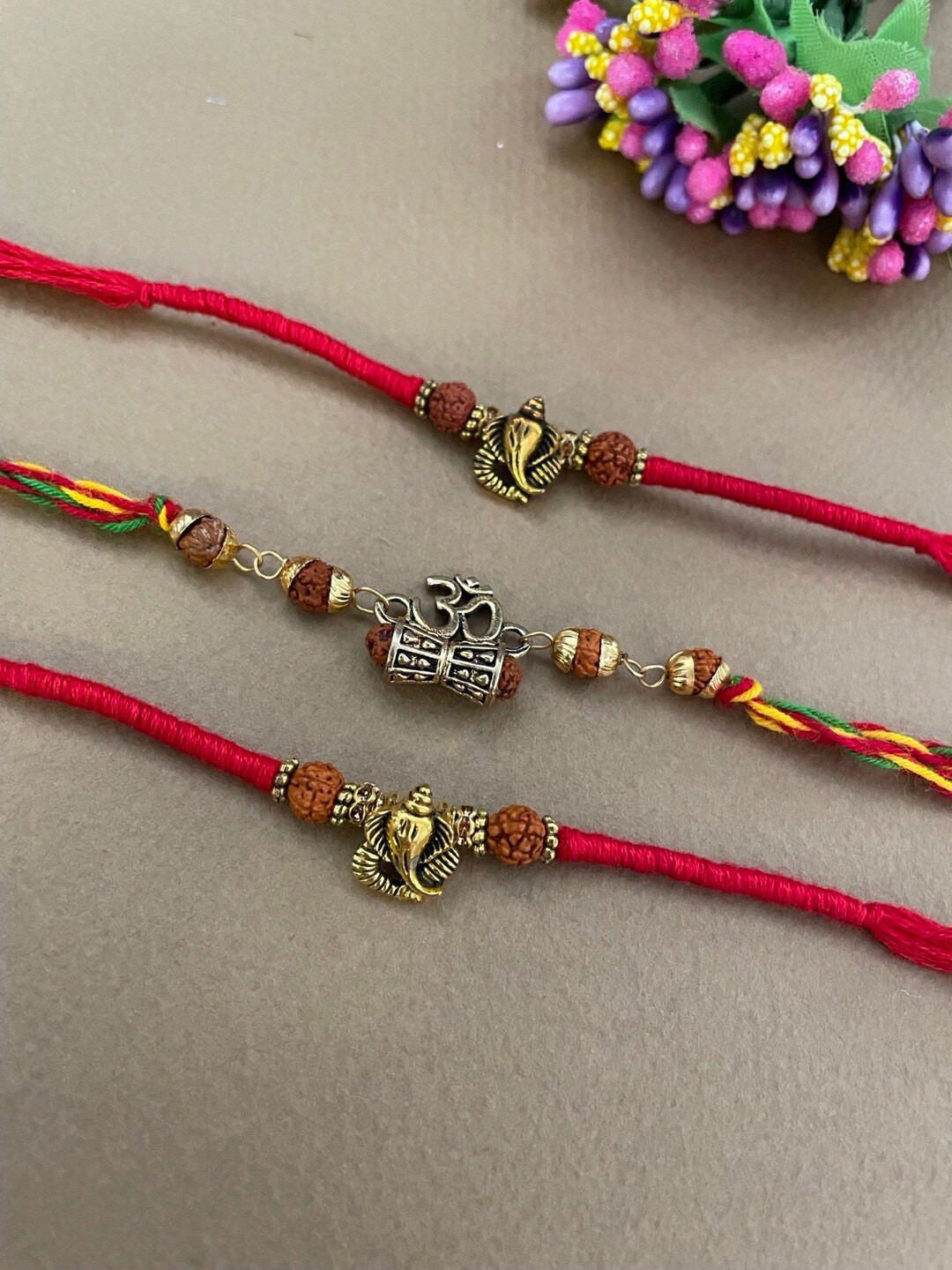 

Digital Dress Room Set Of 3 Beaded Thread Rakhis, Gold