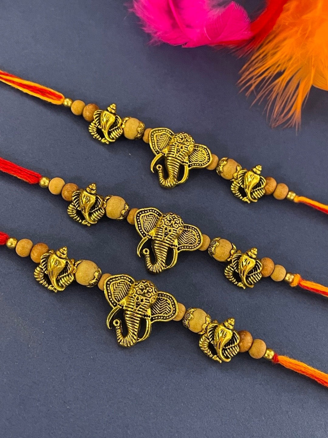 

Digital Dress Room Set Of 3 Ganesha & Chandan Beads Charm Thread Rakhis, Gold