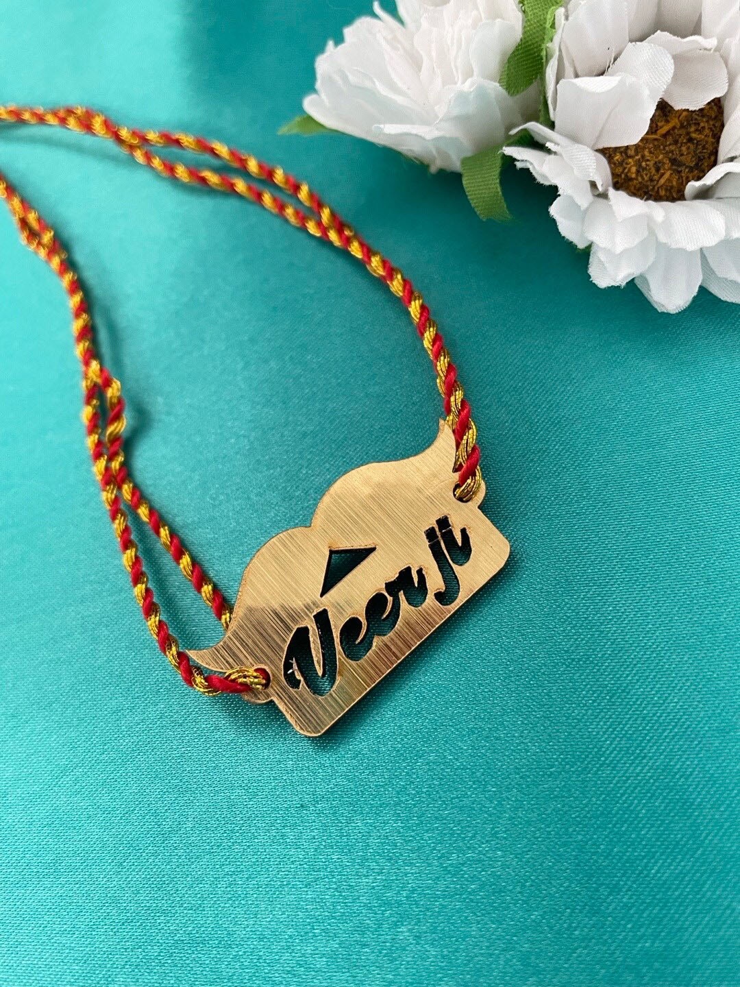 

Digital Dress Room Funky Muchchad Veerji Charm Rakhi, Gold
