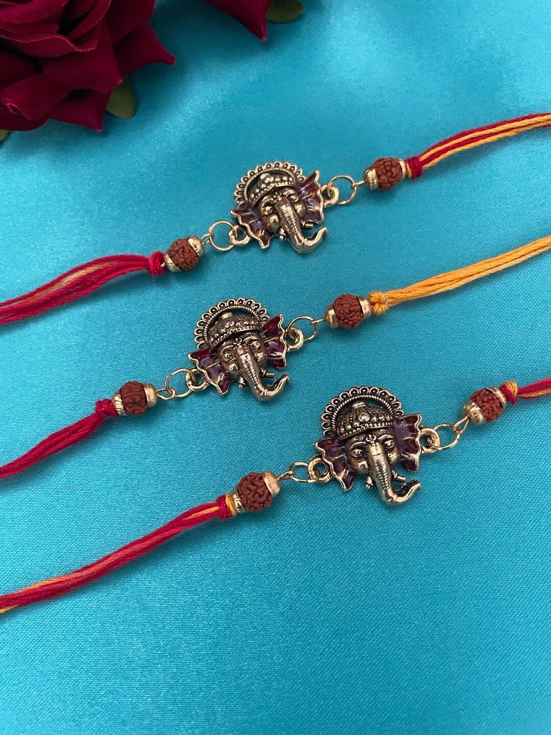 

Digital Dress Room Set Of 3 Ganesha & Rudraksha-Beaded Rakhi, Gold