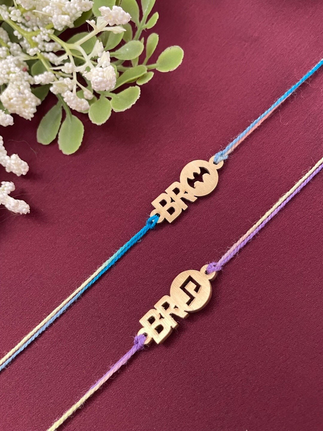 

Digital Dress Room Set Of 2 Music Charm Rakhis, Gold