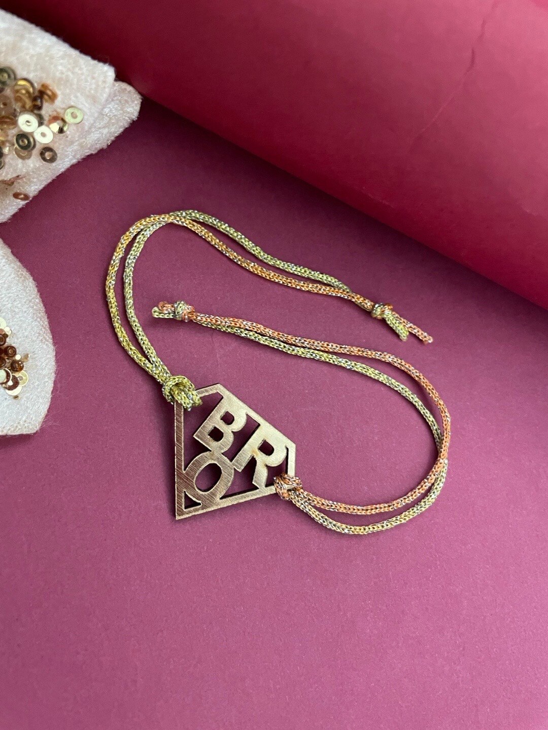 

Digital Dress Room Charm Rakhi, Gold