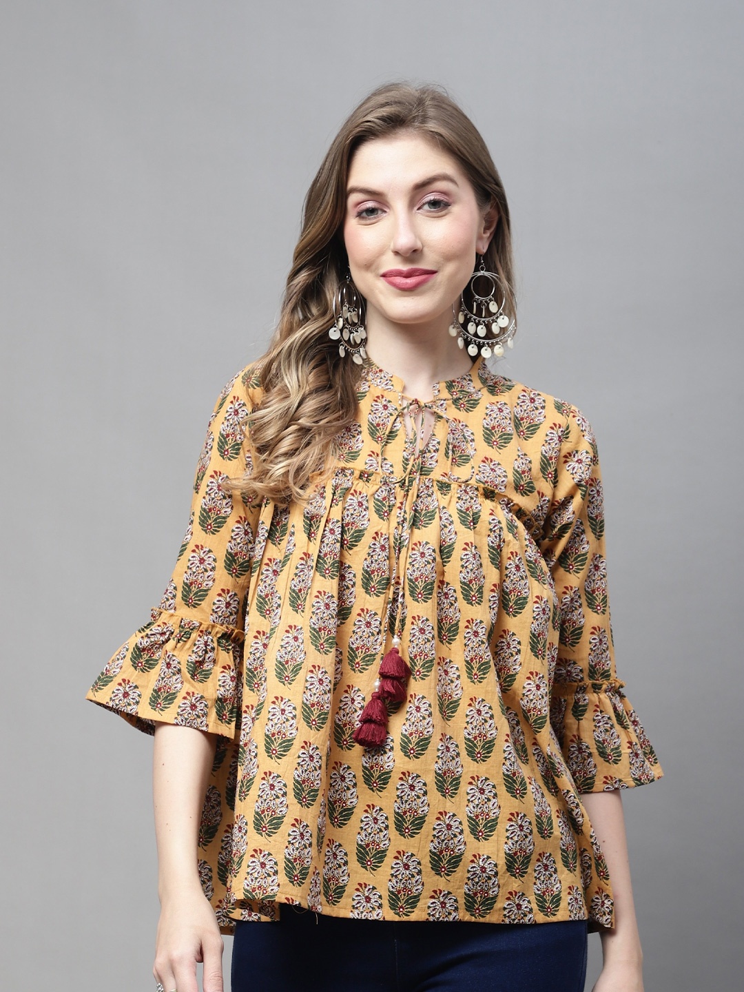 

Rajnandini Floral Printed Tie Up Neck Bell Sleeve Pure Cotton Top, Mustard