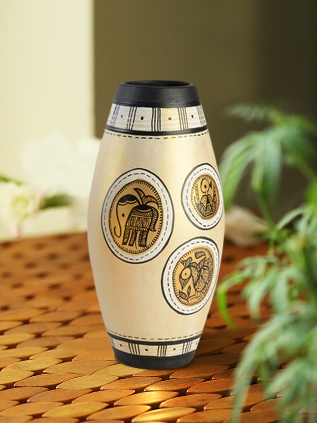 

ExclusiveLane Yellow Madhubani Terracotta Hand Painted Dholak Shaped Vase