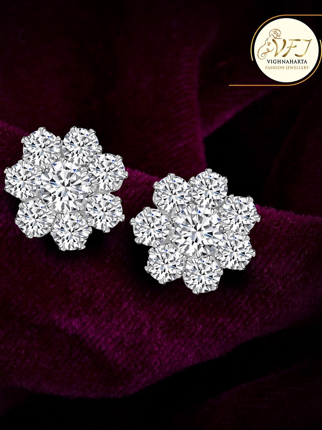 

Vighnaharta Rhodium-Plated Oxidised Stone Studded Floral Shaped Studs Earrings, Silver