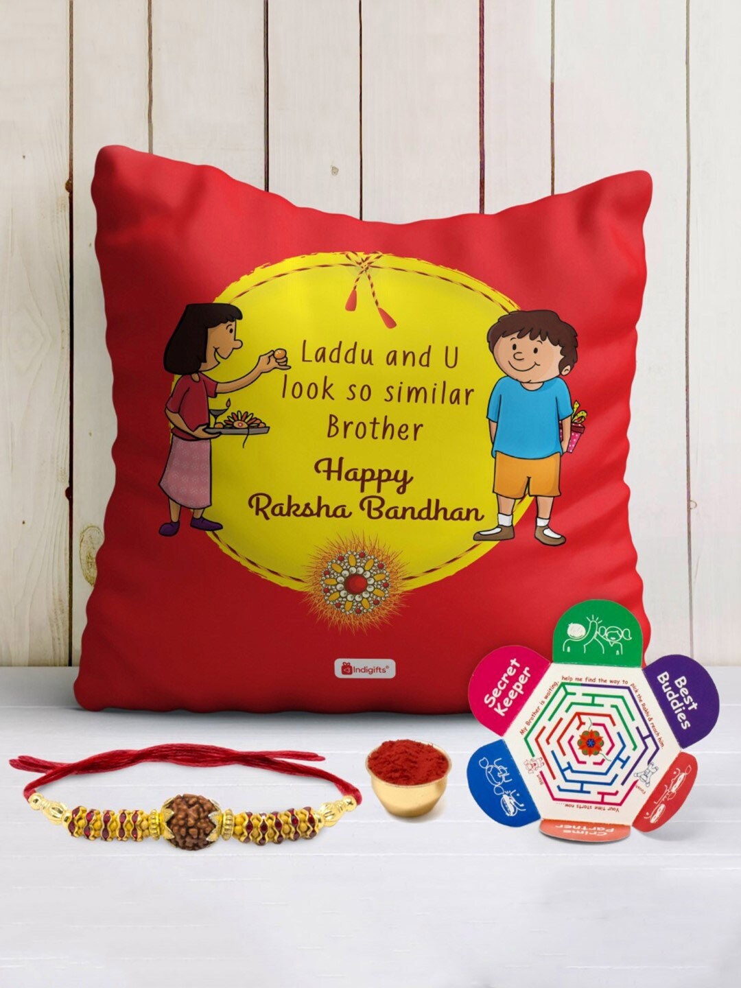 

Indigifts Rudraksha Rakhi With Printed Cushion, Red