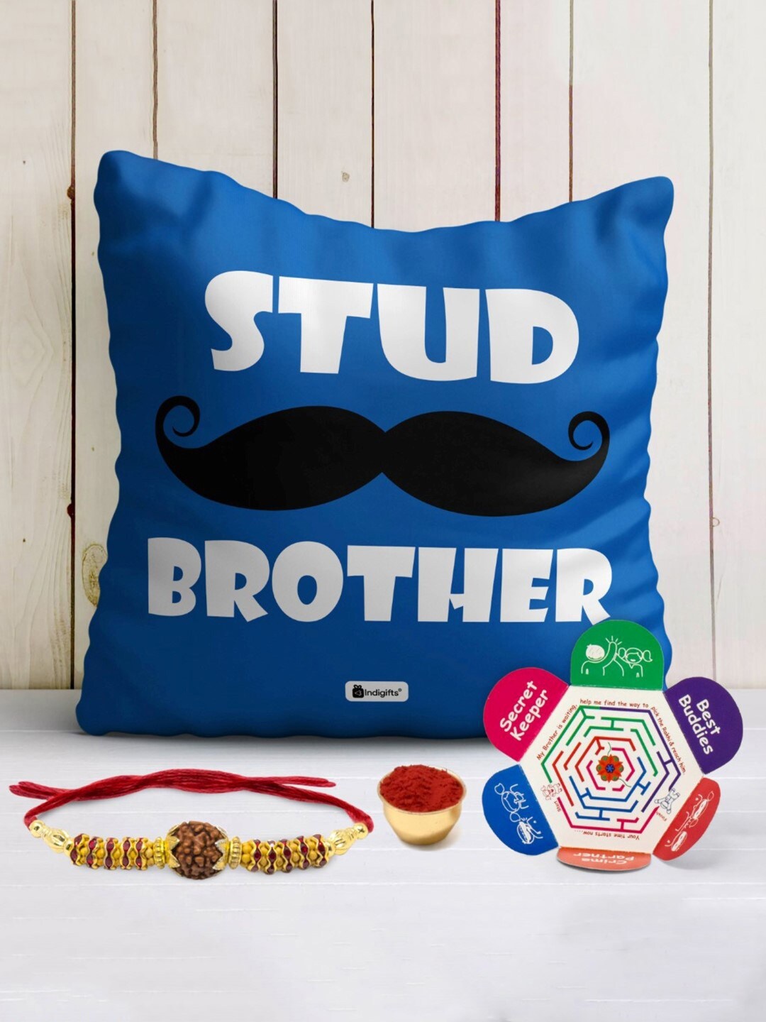 

Indigifts Set Of 4 Rudhrakshi Rakhi With Roli & Cushion with Greeting Card, Blue