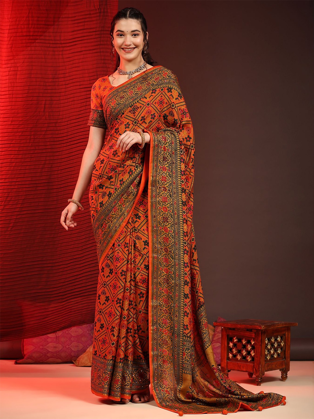 

Phenav Ethnic Motifs Printed Zari Art Silk Patola Saree, Orange