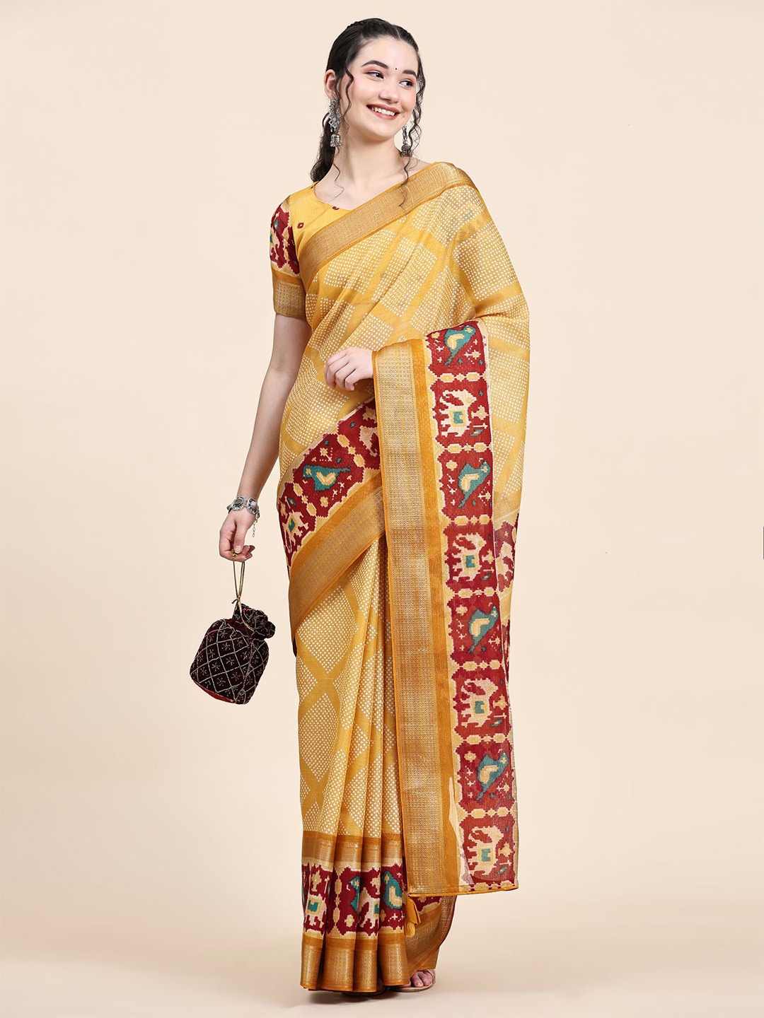 

Phenav Ethnic Motifs Printed Zari Patola Saree, Yellow