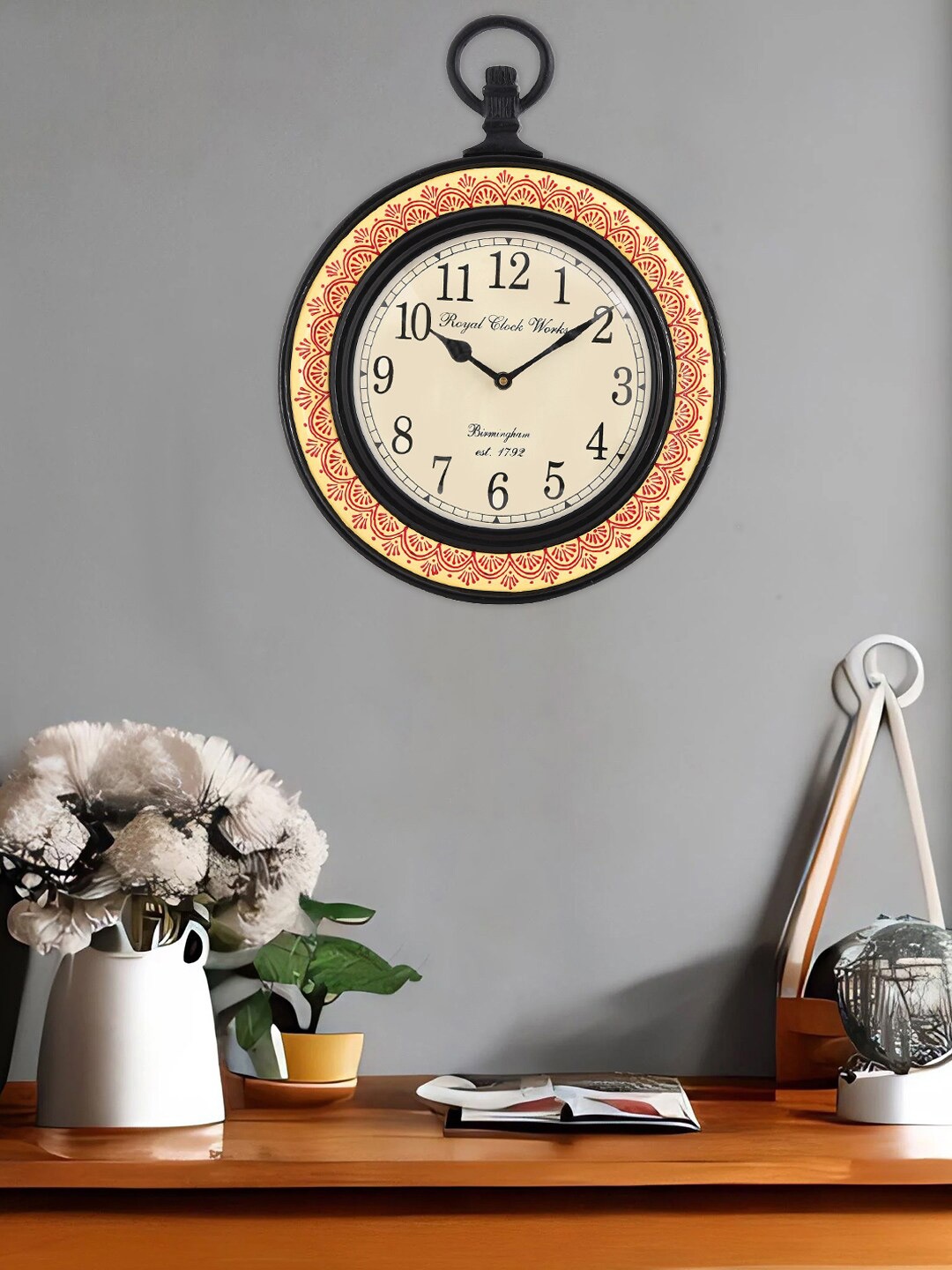 

Aapno Rajasthan White & Yellow Printed Traditional Wall Clock
