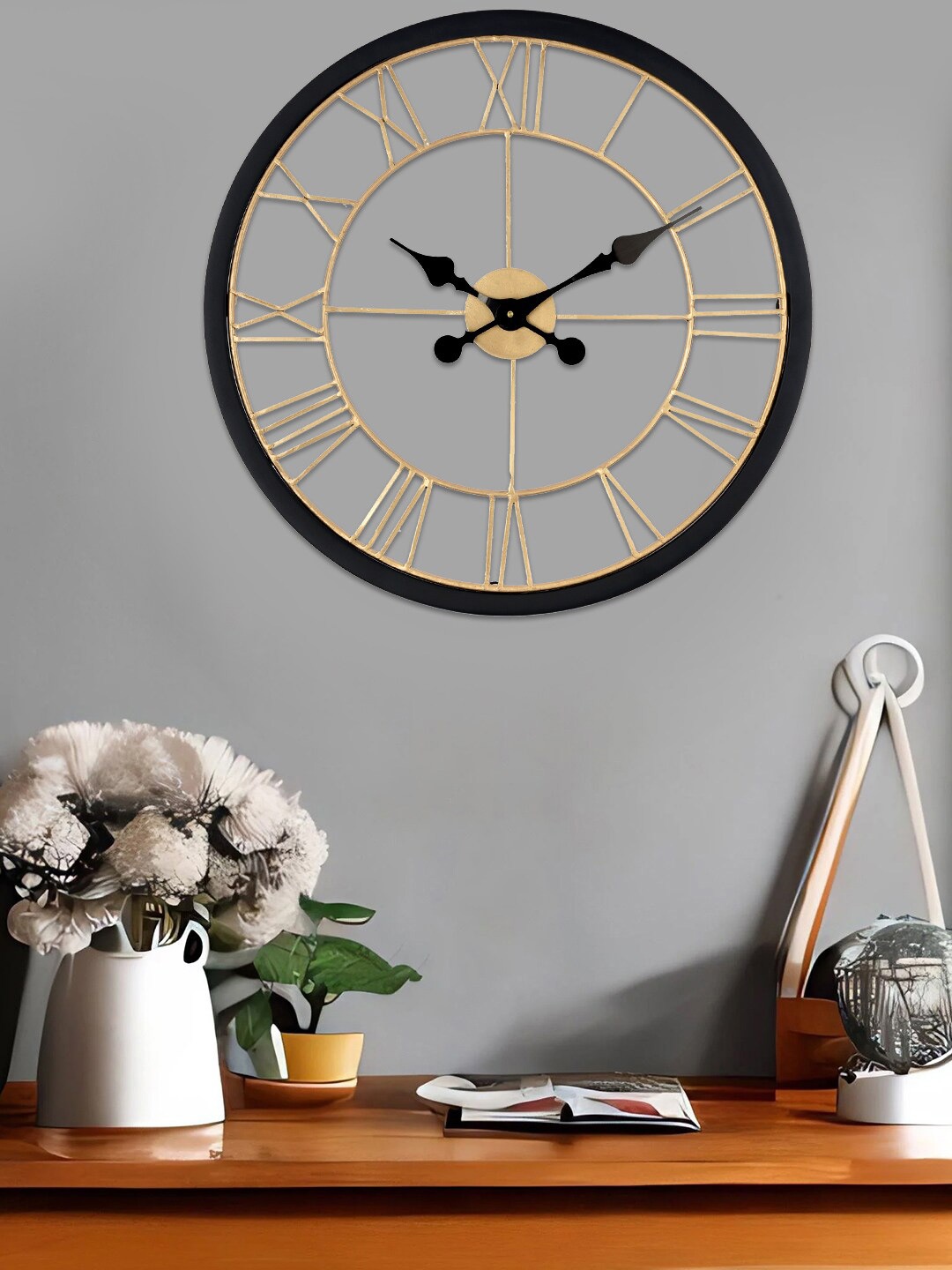 

Aapno Rajasthan Black & Gold-Toned Contemporary Wall Clock